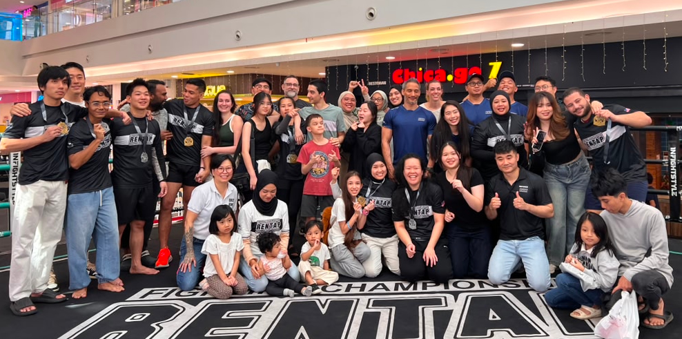 SBG Borneo members drilling together in class, smiling mid-technique