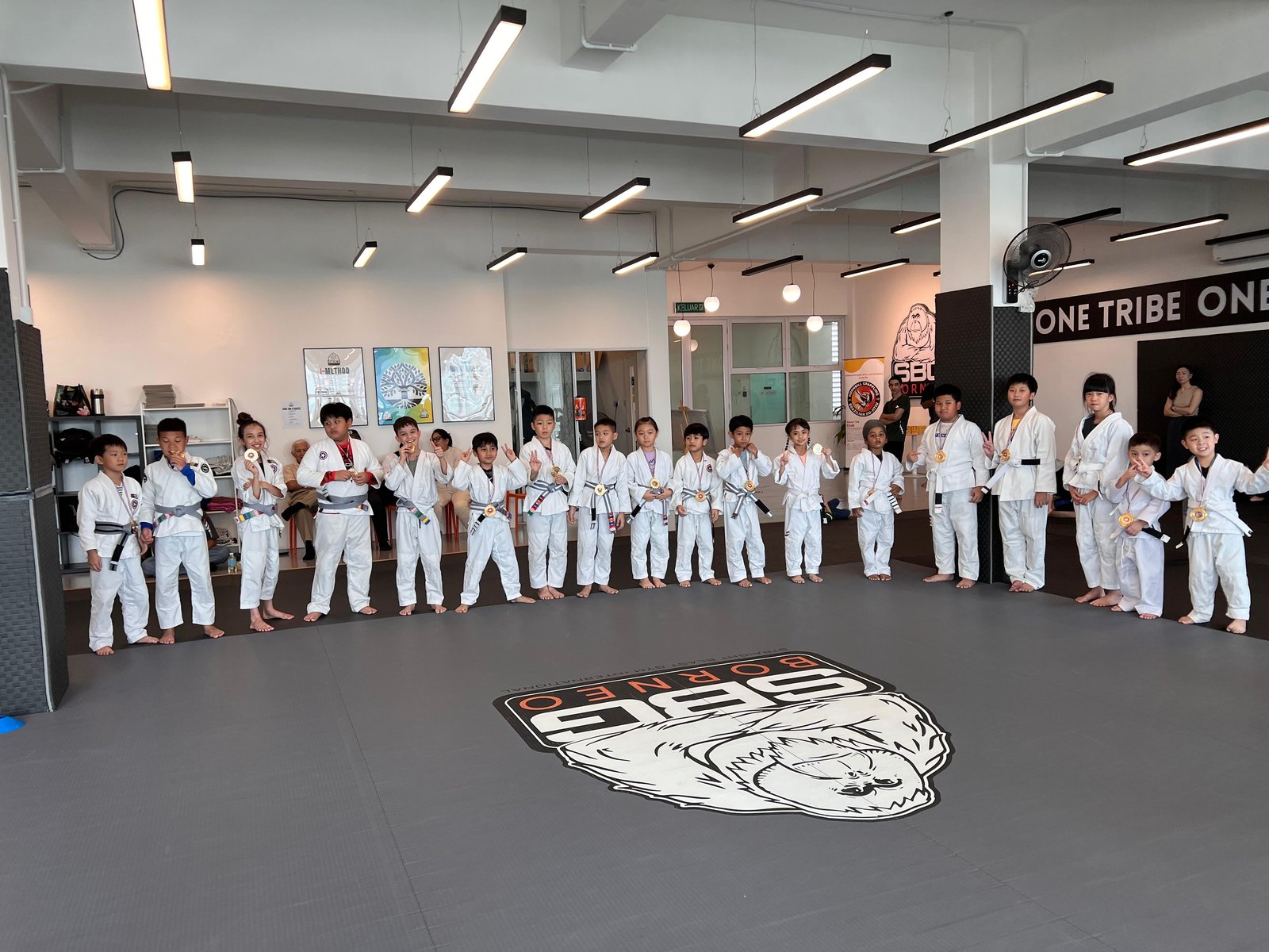 SBG Borneo coaches and members gathered after a Saturday class, all smiling