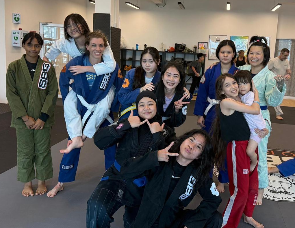 Women's BJJ class at SBG Borneo working on a takedown drill together